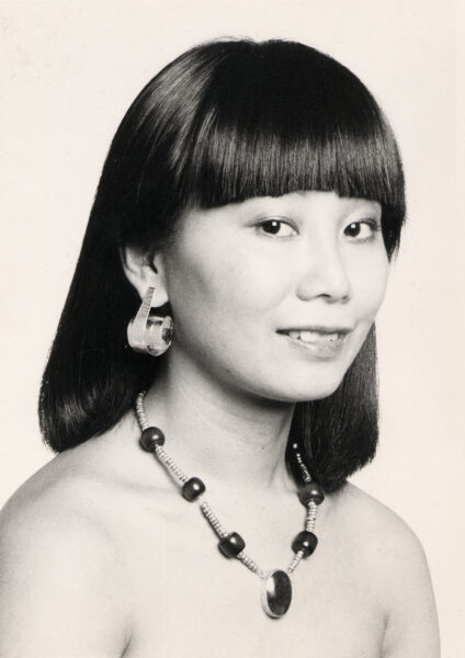Model Irene wearing Sandy's Whistle Earrings and a one-of-a-kind stone necklace. A Shawn Walker photo.