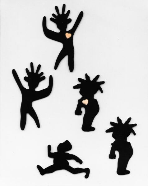 Her Spirit Pins, cut figures in motion.