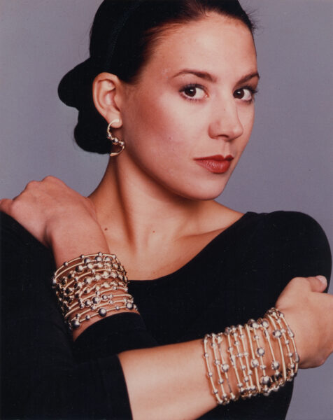 The GRAND BASSAM Collection worn as stacked cuffs, from the same session.